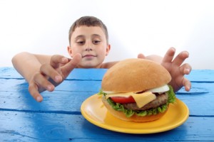 boy with burger junk food