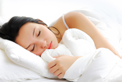 Beautiful woman lying and sleep on the snowy bed